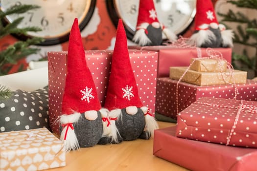 Christmas gnome decor with santa hat. Holiday bohek background.