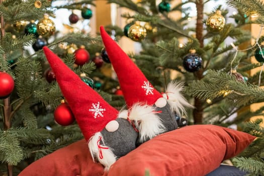 Old Scandinavian Dwarf Wearing Gray Clothes and Red Hat. Christmas Gnome on White Background with Free Space for Text.