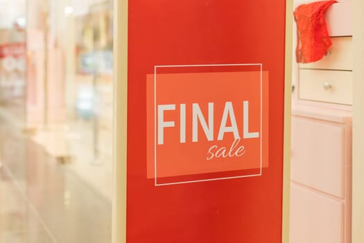 Red sign in front of shop saying Final Sale