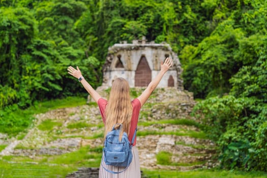 Female tourist exploring the ancient pyramids of Palenque, Mexico, surrounded by dense jungle. Cultural heritage and adventure travel concept.