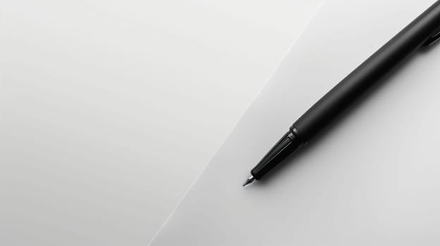 The image features a black ink pen laid diagonally across a pristine white surface, showcasing its sleek design. The bright lighting emphasizes the pen's glossy finish and contrasting color against the background. The simplicity of the setup draws attention to the pen, inviting thoughts of creativity and writing.