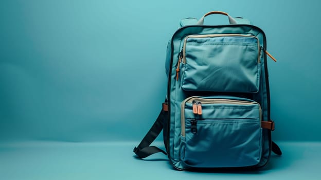 A durable backpack featuring several compartments is displayed open on a light blue background. This design allows easy access to belongings, making it suitable for travel, school, or outdoor activities. The thoughtful layout provides organized storage for personal items.