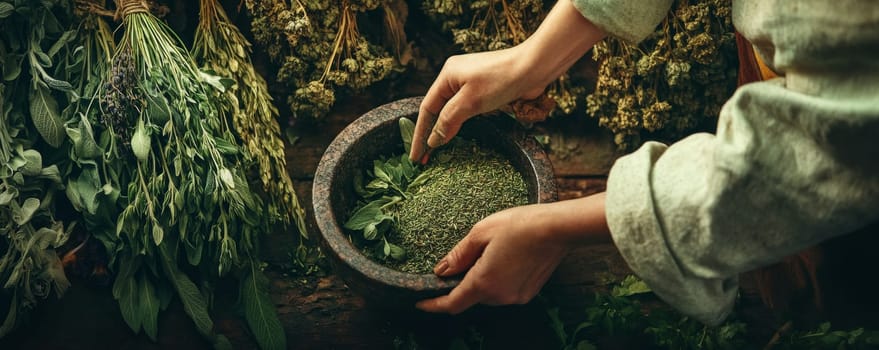 Hands grinding herbs in stone mortar in rustic setting.