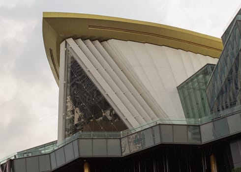 Bangkok, Thailand - 28 Sep, 2024 - Architecture exterior of A steel A-frame glazed triangular front facade of Iconsiam shopping mall with sky background at afternoon. Space for text, Selective focus.