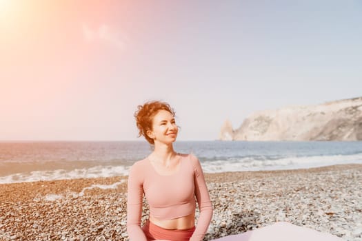 Middle aged well looking woman with black hair doing Pilates with the ring on the yoga mat near the sea on the pebble beach. Female fitness yoga concept. Healthy lifestyle, harmony and meditation.