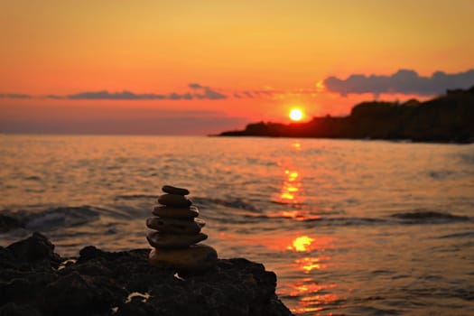 Beautiful colourful sunset on the beach with the sea and waves. A concept for travel, holidays and summer holidays by the sea. Greece - Corfu island - Agios Georgios