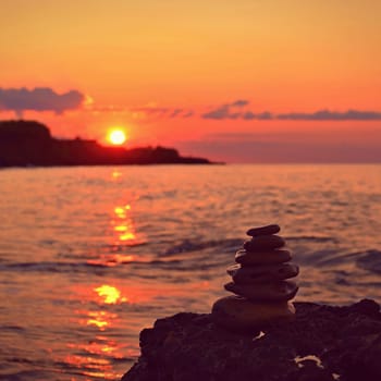 Beautiful colourful sunset on the beach with the sea and waves. A concept for travel, holidays and summer holidays by the sea. Greece - Corfu island - Agios Georgios