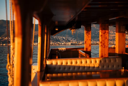 This boat interior has cozy seating for enjoying stunning sunset views and ultimate relaxation on the water