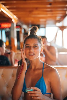 A vibrant and joyful summer moment experienced on a boat, highlighting skincare while enjoying fun times with friends