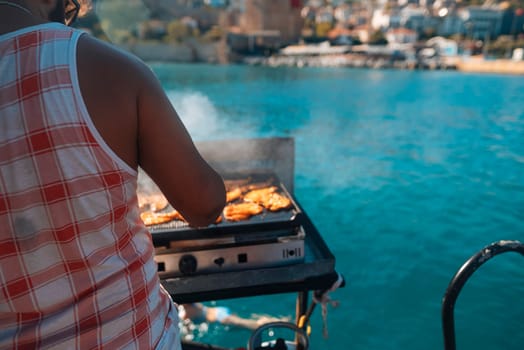 On this beautiful sunny day, I am grilling some absolutely delicious fish near the serene, glistening waters