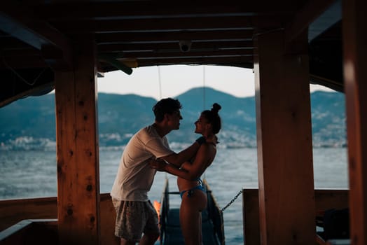 A couple enjoys a tender and intimate moment on a beautiful boat, surrounded by the stunning beauty of nature
