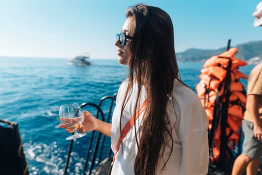 Enjoying a peaceful moment on a luxury yacht, taking in ocean views while sipping a drink embodies true relaxation