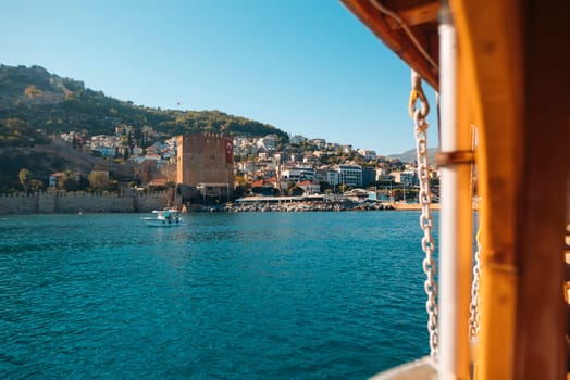 A beautiful and picturesque coastal view showcasing a historic tower along with serene calm blue waters