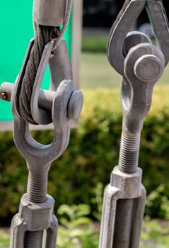 Metal ring and Steel cabling attached to a shackle. Steel wire rope slings with Thimble and safety anchor shackle turnbuckle connection bolt for heavy work, Device for adjusting the tension or length cable, Copy space, Selective Focus.