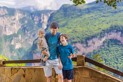 Dad and his two sons baby and teenager travelers exploring Sumidero Canyon National Park, Mexico. Adventure, natural exploration, and travel experience concept.