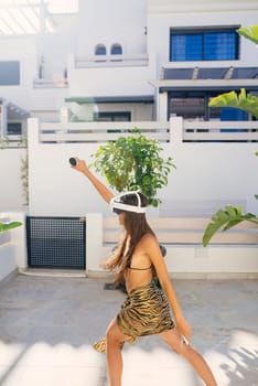A woman enjoys an engaging outdoor activity, confidently showcasing her unique fashion in a modern setting