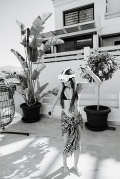 A woman in a bikini and VR headset dances joyfully in a vibrant outdoor setting, celebrating summer and tech