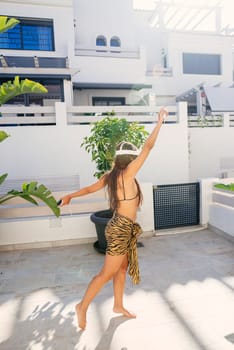 A carefree woman enjoying life in a stunningly vibrant setting, radiating confidence, joy, and happiness