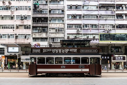 HONG KONG, CHINA - SEPTEMBER 29 2024: Streetscape with busy roads and trams in Wan Chai on Hong Kong Island in Hong Kong China