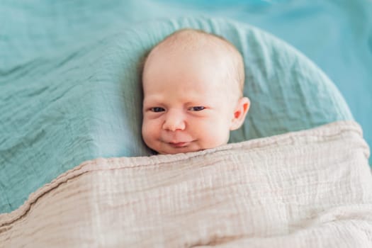 The baby is sleeping peacefully in his cozy nest. Newborn photo session captures the serene innocence and warmth of early moments.