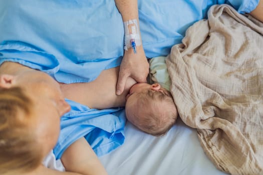 A mom breastfeeds her newborn baby in the hospital. The intimate moment fosters bonding between mother and child, promoting emotional connection and providing essential nourishment for the baby's well-being.