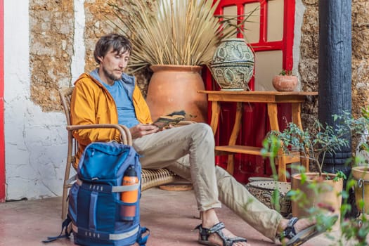Male tourist in a colonial house in San Cristobal de las Casas, Mexico. Cultural exploration, architecture, and travel experience concept.