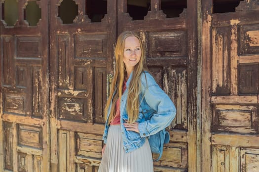 Female tourist walks through the colonial streets San Cristobal de las Casas, Mexico. Cultural exploration, architecture, and travel experience concept.