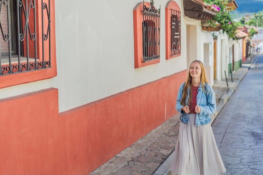 Female tourist walks through the colonial streets San Cristobal de las Casas, Mexico. Cultural exploration, architecture, and travel experience concept.