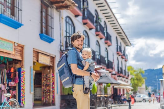 Father and his son tourists walks through the colonial streets San Cristobal de las Casas, Mexico. Cultural exploration, architecture, and travel experience concept.