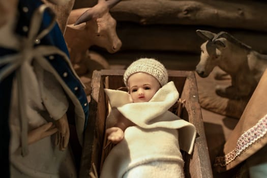 Baby Jesus laying in a cradle Christmas Creche