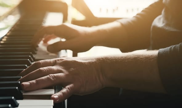 Man hands playing piano keyboard closeup and creating instrumental composition with professional sound. Musician perfomance with classical music on pianoforte