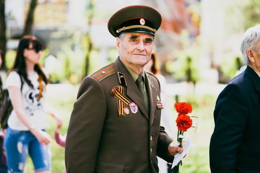 VICHUGA, RUSSIA - MAY 9, 2016: A veteran of World War II on the Victory day Parade in Russia. The March Of The Immortal Regiment, May 9