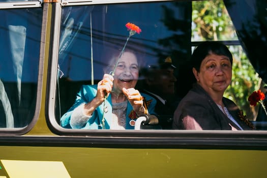 VICHUGA, RUSSIA - MAY 9, 2016: A veteran of World War II on the Victory day Parade in Russia. The March Of The Immortal Regiment, May 9