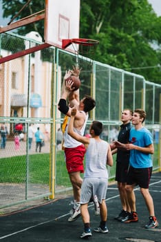 VICHUGA, RUSSIA - JUNE 11, 2016: Teenagers playing streetball on the celebration of the city of Vichuga, Russia