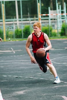 VICHUGA, RUSSIA - JUNE 11, 2016: Teenagers playing streetball on the celebration of the city of Vichuga, Russia