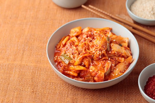 Kimchi, Kimchee in the Bowl, Red Spicy Kim Chi, Hot Fermented Napa Cabbage, Traditional Jimchi, Korean cuisine, top view horizontal banner with a copy space