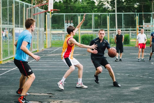 VICHUGA, RUSSIA - JUNE 11, 2016: Teenagers playing streetball on the celebration of the city of Vichuga, Russia