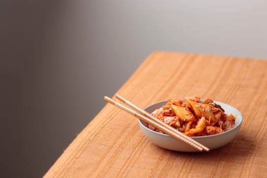 Kimchi, Kimchee in the Bowl, Red Spicy Kim Chi, Hot Fermented Napa Cabbage, Traditional Jimchi, Korean cuisine, horizontal banner with a copy space
