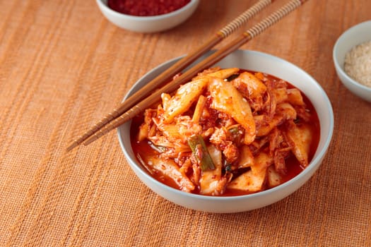 Kimchi, Kimchee in the Bowl, Red Spicy Kim Chi, Hot Fermented Napa Cabbage, Traditional Jimchi, Korean cuisine, horizontal banner with a copy space