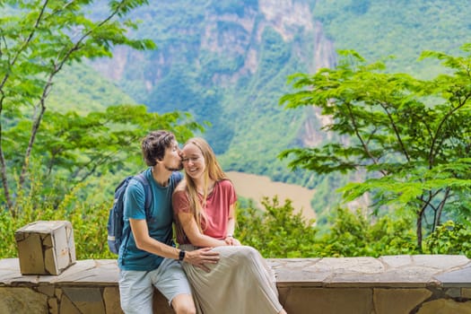 Man and woman embracing and admiring the view of Sumidero Canyon National Park, Mexico. Love, honeymoon, nature, and travel experience concept.