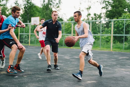 VICHUGA, RUSSIA - JUNE 11, 2016: Teenagers playing streetball on the celebration of the city of Vichuga, Russia