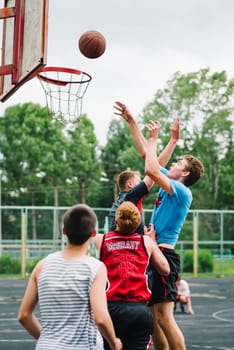 VICHUGA, RUSSIA - JUNE 11, 2016: Teenagers playing streetball on the celebration of the city of Vichuga, Russia
