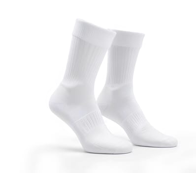 Blank white socks design mockup, isolated, clipping path. Pair sport crew cotton socks wear mock up. Long clear soft sock stand presentation. Men basketball, football, tennis plain socks template. High quality photo.