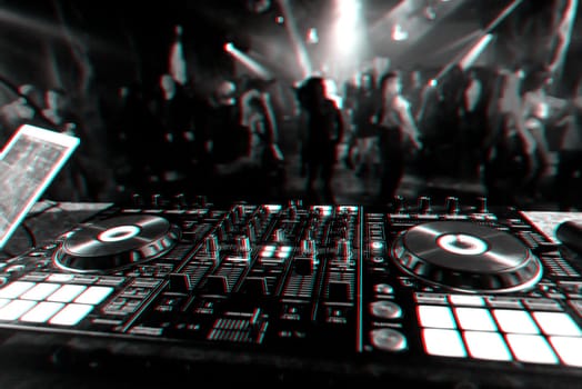 music mixer DJ controller Board for professional mixing of electronic music in a nightclub at a party. Black and white photo with glitch effect and small grain