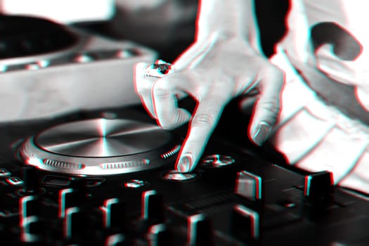 hand girls DJ music controller for mixing music in the club. Black and white photo with glitch effect and small grain