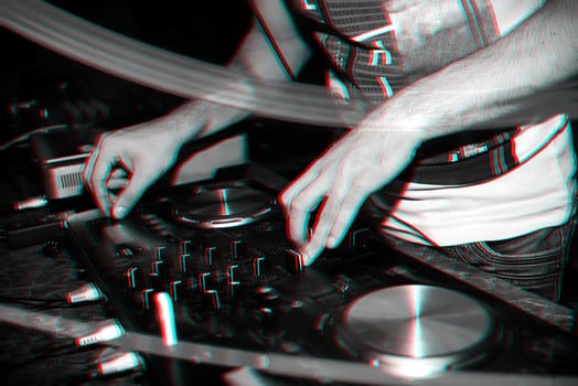 hands of the regulators twist DJ music on DJ equipment in a nightclub. Black and white photo with glitch effect and small grain