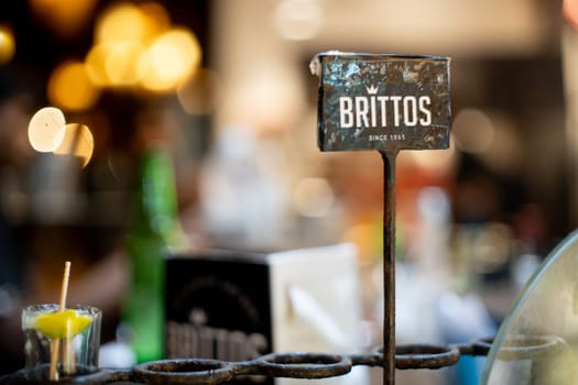 Goa, India - 16th Aug 2024: Small table flag of Brittos famous shack and great place for food seafood and drinks on the beach