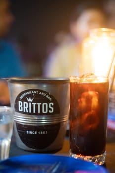 Goa, India - 16th Aug 2024: Macro shot showing ice bucket of famous bar shack Brittos on Baga beach a popular spot for drinks, seafood, food, music, karaoke and more