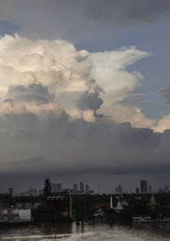 Bangkok, Thailand - 04 Oct, 2024 - Amazing Clouds and Sky over view of Bang kachao with the Chao Phraya River before sunset. use it as your wallpaper, poster and Space for text, Selective focus.