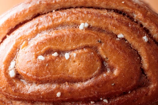 Korvapuusti, traditional finnish cinnamon and cardamom rolls, close-up of fresh baked bun, sweet dessert Sweden and Finland